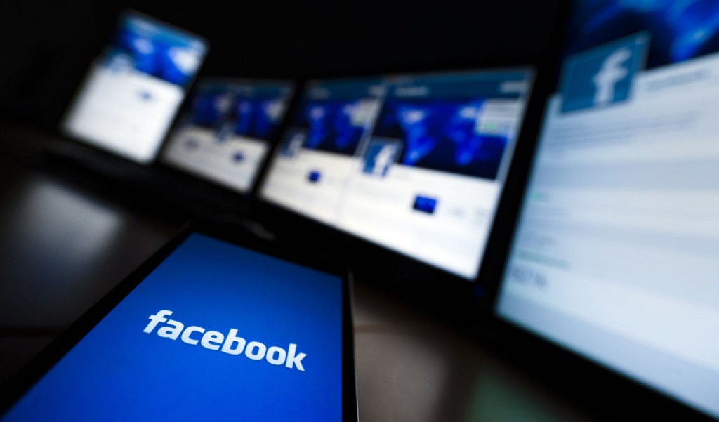 The loading screen of the Facebook application on a mobile phone is seen in this photo illustration taken in Lavigny