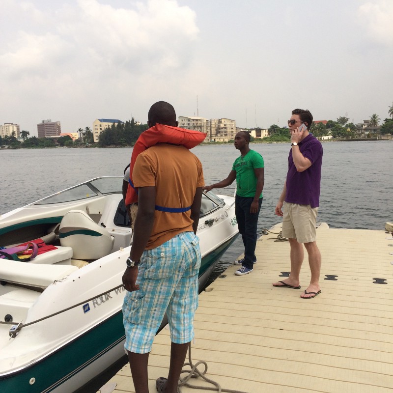 Jonas in front of the Lagos Lagoon — business happens over boat rides